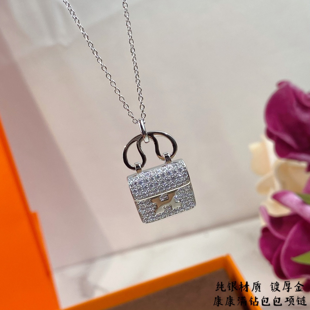 H**me5 fully di*m*nd-encrusted h bag necklace