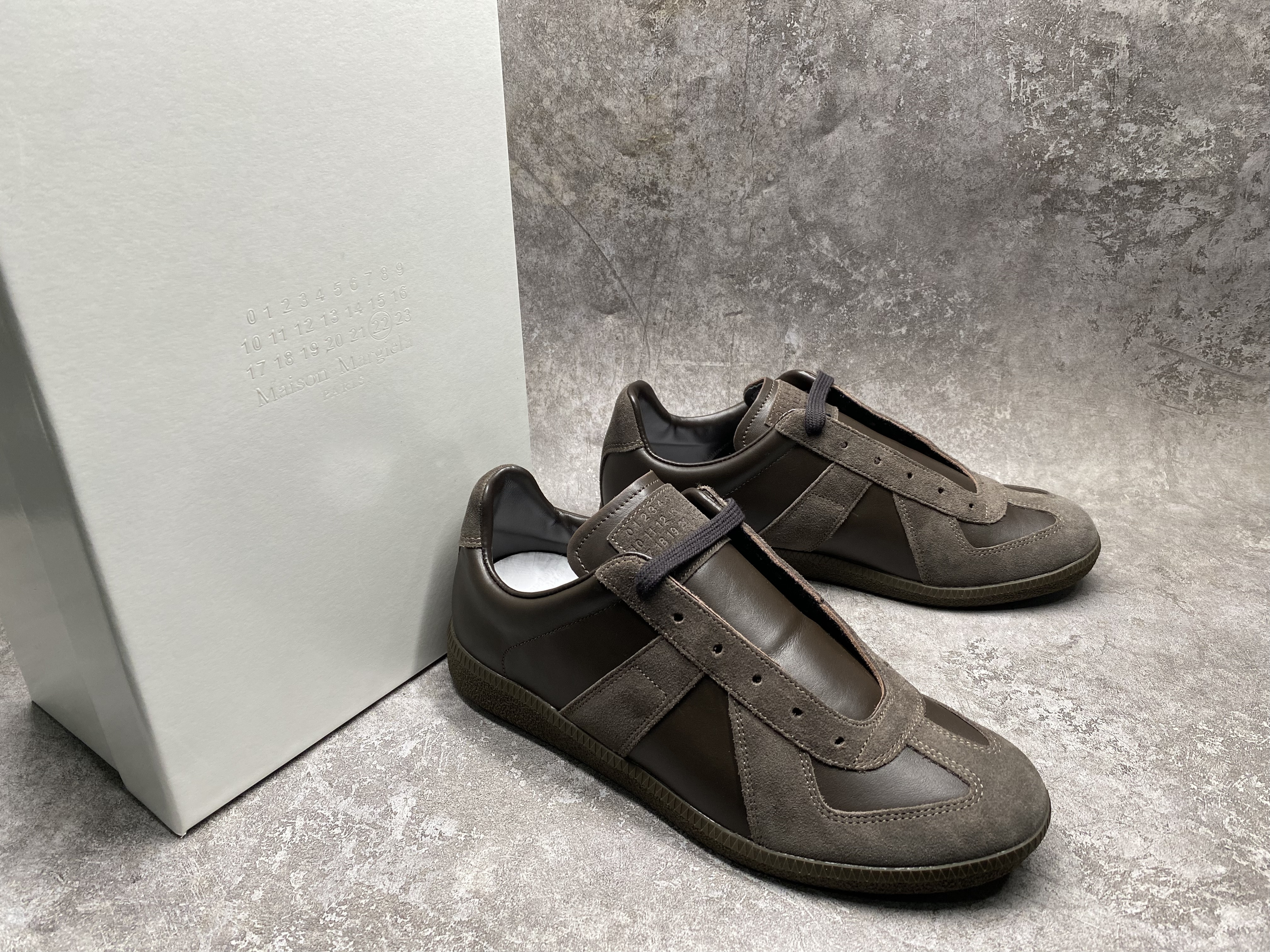 ua ma*s*n Ma*i*la mm6 sneakers