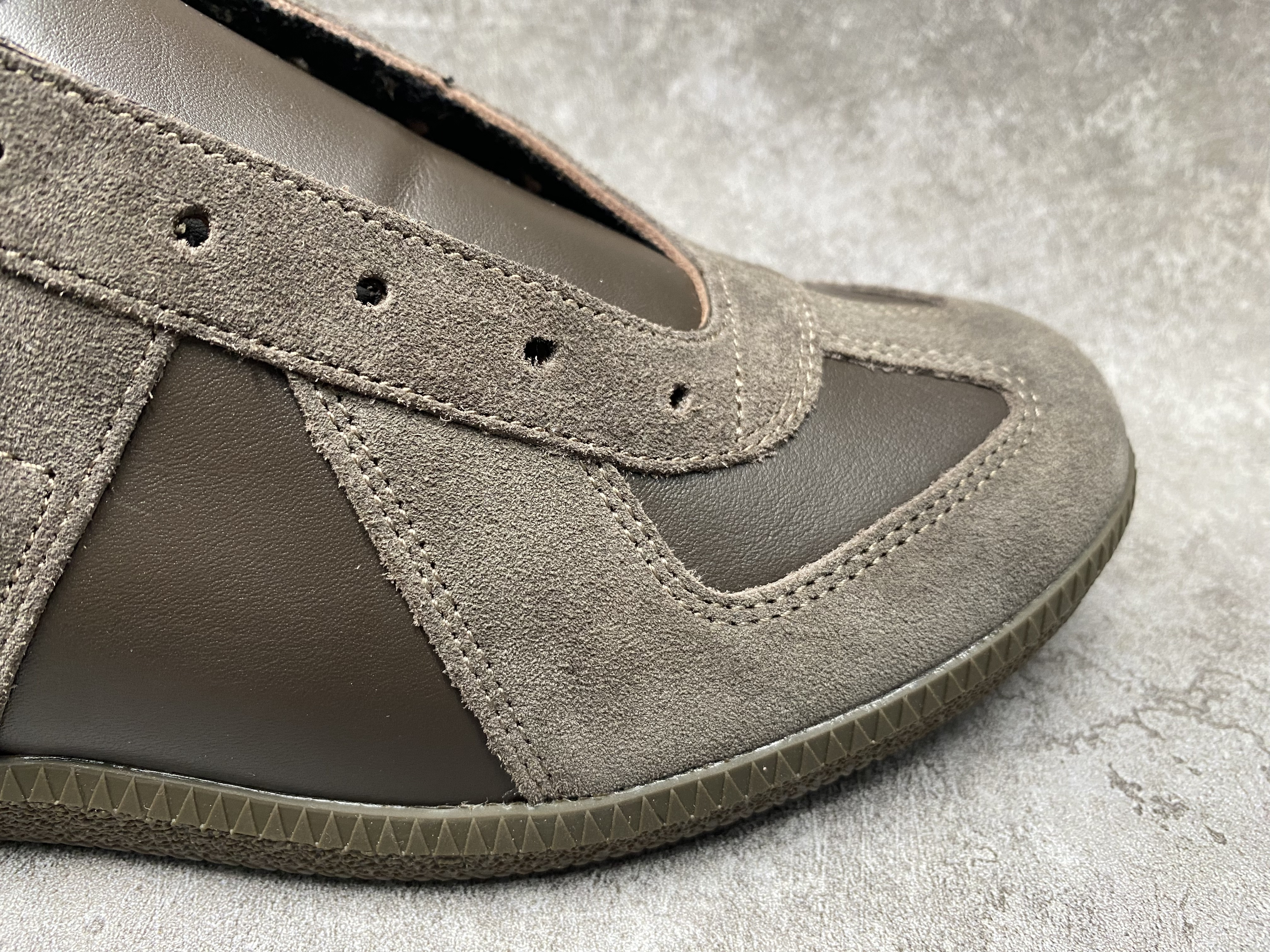 ua ma*s*n Ma*i*la mm6 sneakers