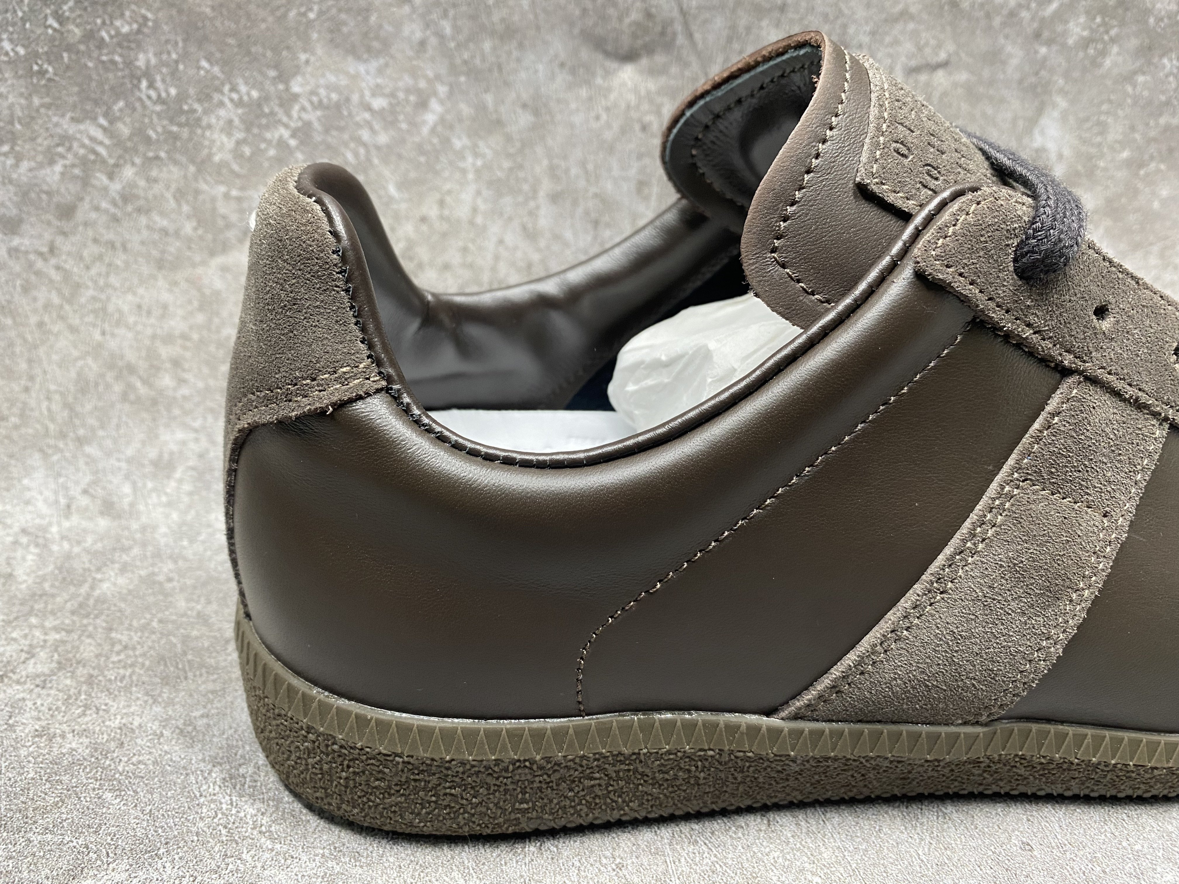 ua ma*s*n Ma*i*la mm6 sneakers