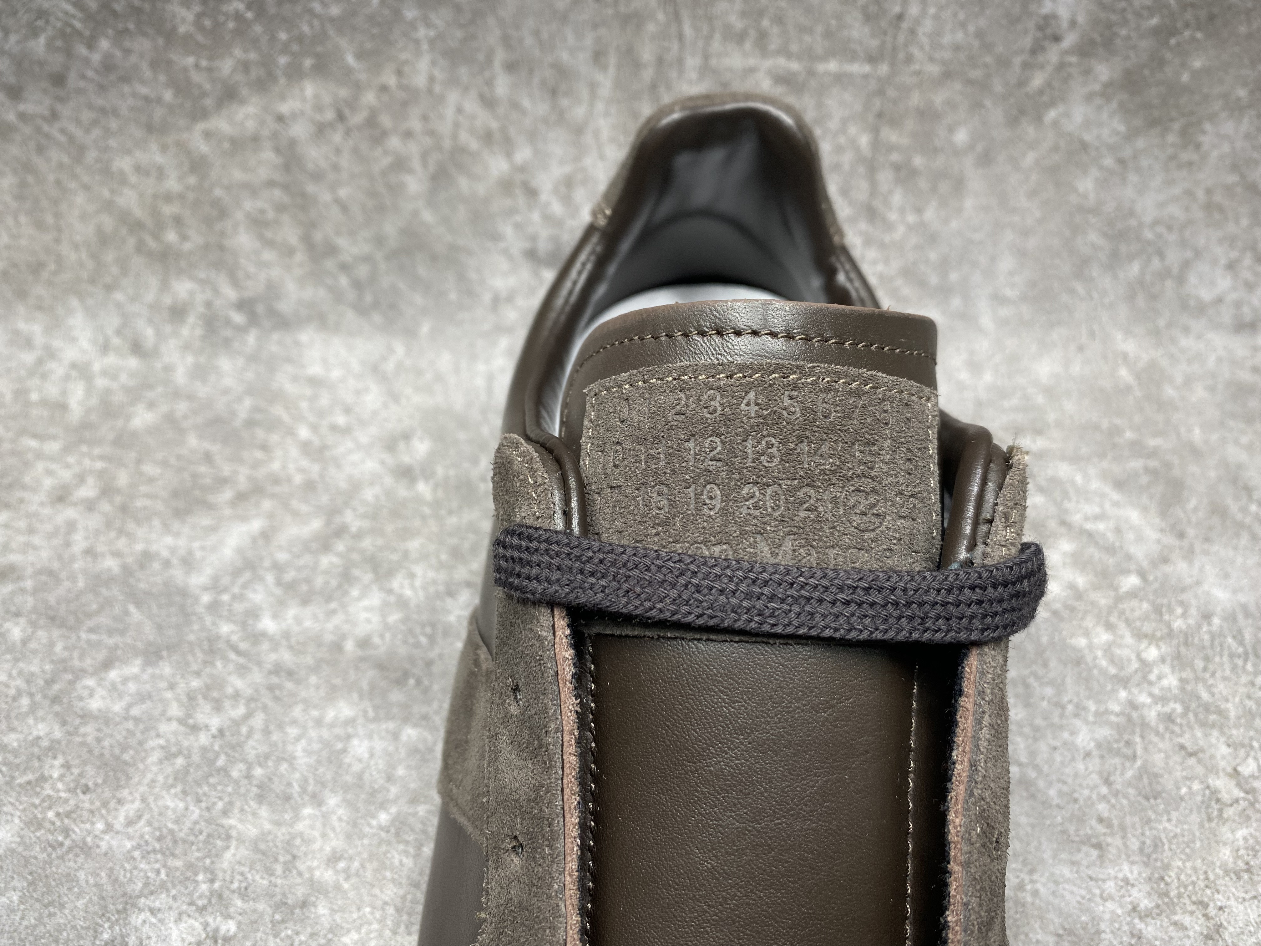 ua ma*s*n Ma*i*la mm6 sneakers